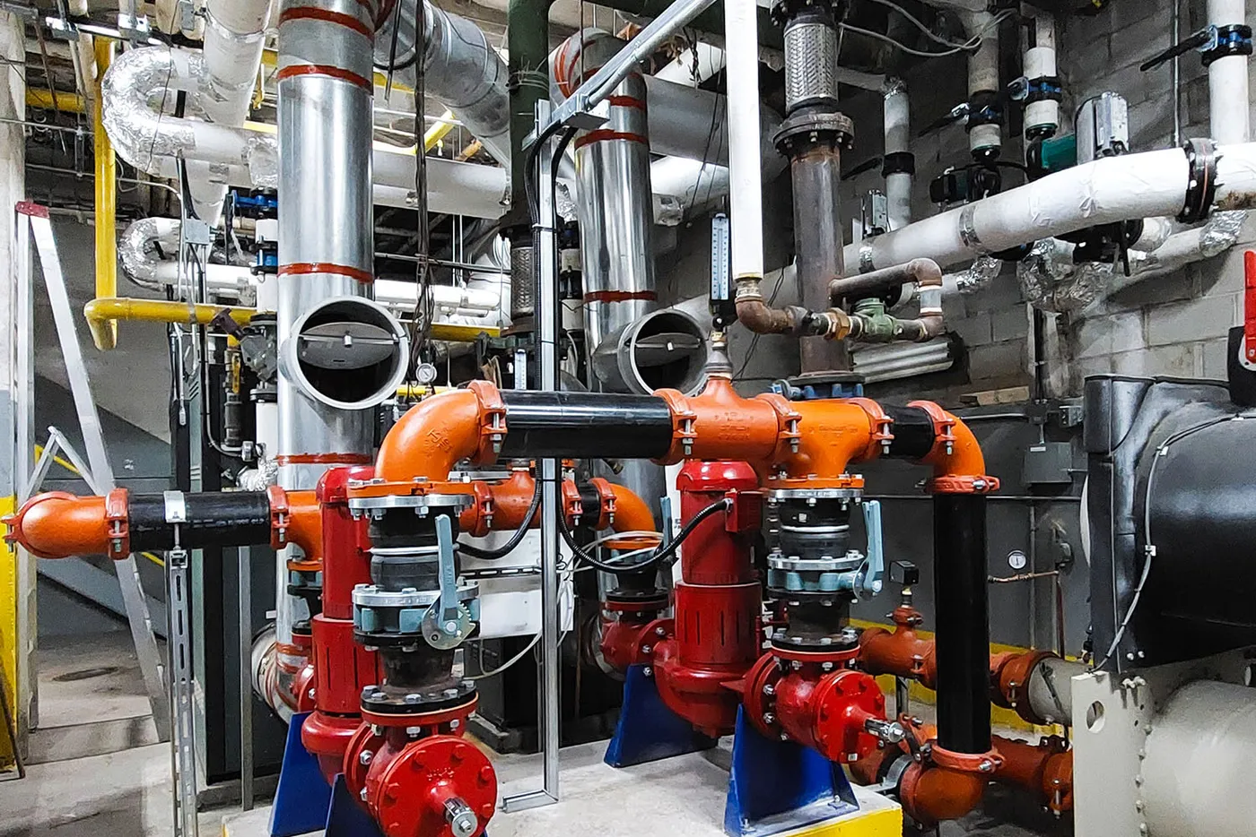 Industrial pumps, piping, and mechanical infrastructure in a service area.